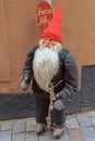 A small Christmas troll standing on the street in front of a the well known souvenir shop Ã¢â¬ÂTomtar and TrollÃ¢â¬Â